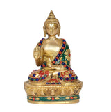 Front view brass meditating Buddha statue, colorful beadwork robe, lotus base