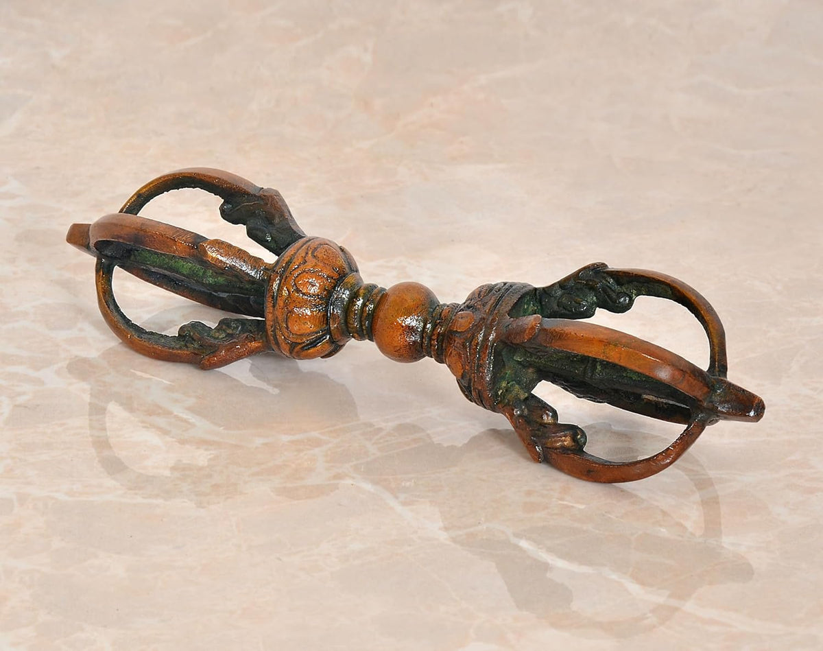 Small brass Tibetan dorje with eight-pronged detail, multicolor aged finish
