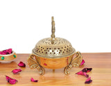 Golden brass loban dhoop dani side view: peacock finial, perforated dome lid