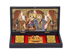 Open gold-plated Radha Krishna photo frame with deity artwork, red-lined gift box tray
