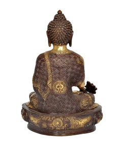 Brass Buddha statue rear view, seated back with engraved robe pattern and star emblem