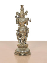 Lord Krishna brass sculpture playing flute, back view showing ornate armor-like carvings