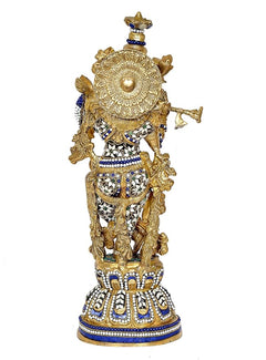 Brass Krishna statue back view, ornate circular headdress, blue and white patterned robe