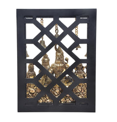 Hanging bells and seated Shiva Parivar idol in brass inside black frame