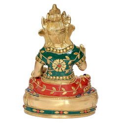 Back/side view of antique brass Kuvera statue, green tunic, red draped cloth, bead trim