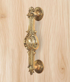 Ornate brass door handle, golden finish, full handle with two round plates