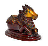 Nandi bull statue head and front legs, gold-toned face with dark brown glossy finish