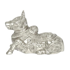 Brass Nandi cow idol statue, lying down with engraved saddle and ornaments