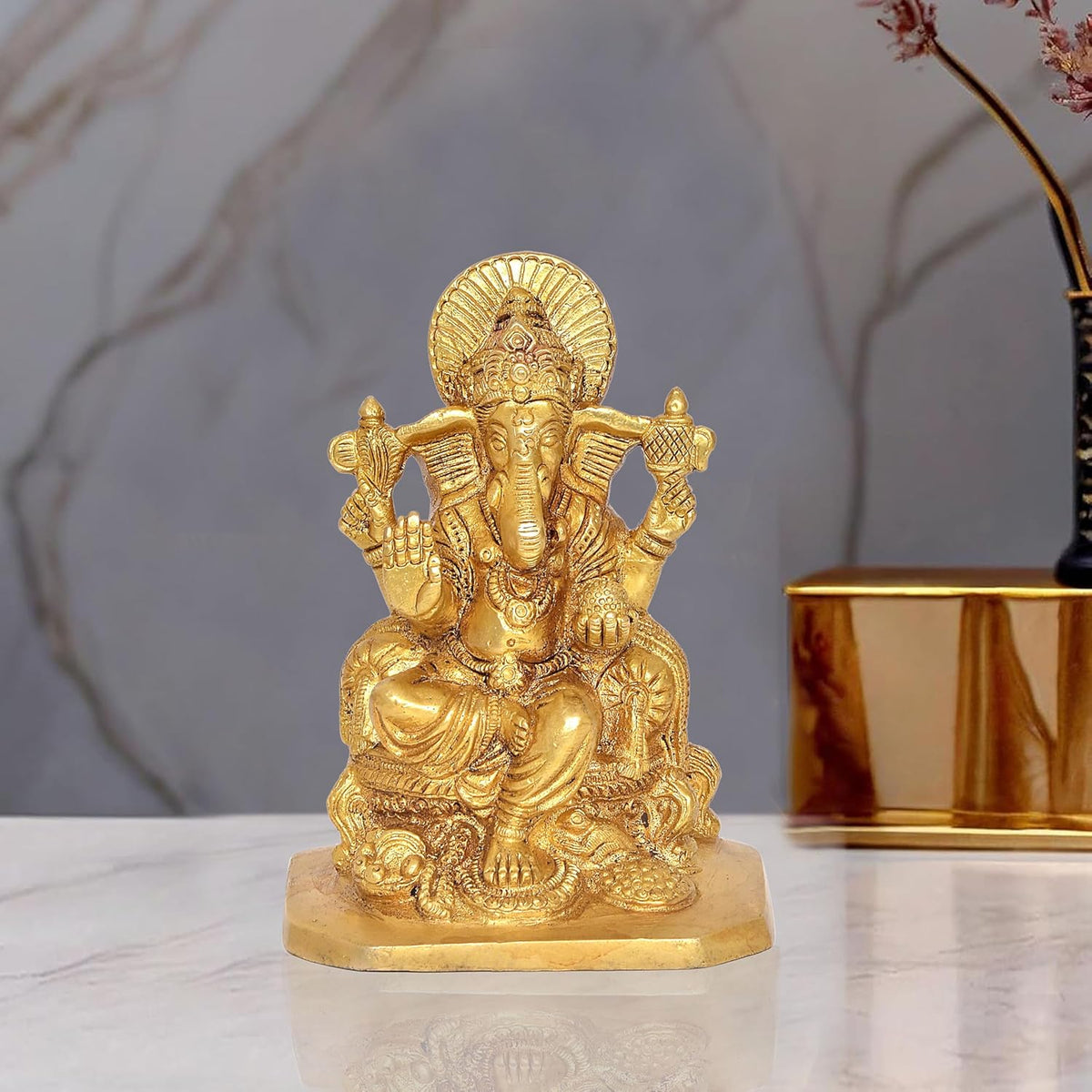 Golden brass Lord Ganesha idol statue with seated pose and ornate details
