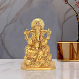 Golden brass Lord Ganesha idol statue with seated pose and ornate details