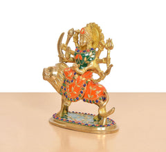 Durga Maa brass idol riding lion, side view, orange dress with green accents