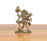 Brass Hanuman murti angled view with circular chest emblem and back detailing