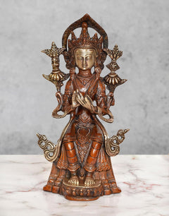 Brass seated Tara Devi statue with ornate crown and four raised arms, 9.5 inch