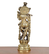 Brass Lord Krishna idol rear view with detailed back ornamentation and pedestal base