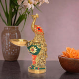 Brass peacock oil lamp diya with green-red enamel and gold tray bowl