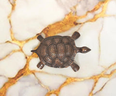 Handcrafted brass tortoise figurine, 1.5 in, back view with carved shell scale details