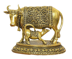 Gold brass cow with calf statue, side view, ornate engraved blanket and base