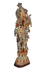 Brass Krishna figurine side view, raised hands, intricate patterned ornaments and back details