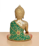 Brass Buddha statue back view, seated pose with green robe and floral motifs