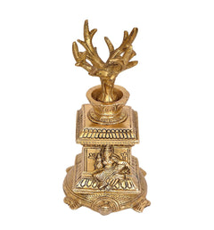 Brass Tulsi plant idol front view, seated figure carvings on base