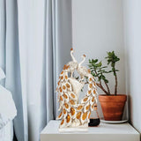Resin peacock couple showpiece, two standing birds with detailed gold-patterned feathers