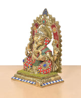 Brass Ganpati idol side view, red drape and blue-white base border, multicolour