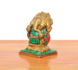 Brass multicolour panchmukhi Ganesha sitting murti, side view with red arm details