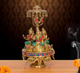 Brass Lakshmi-Ganesha-Saraswati idol on moving chowki with parasol, multicolor, 14 in