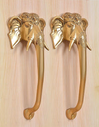 Golden brass door handles featuring Ganesha face with long curved lever and round screws