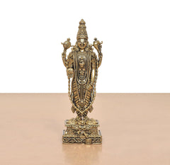 Front view standing Lord Balaji idol with engraved jewelry and layered garments