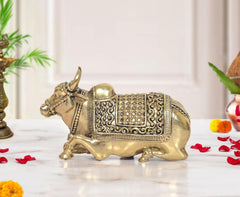 Superfine Brass Nandi idol with ornate saddle detailing and raised tail, side view