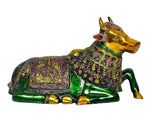 Brass Nandi bull statue lying down, glossy green finish and detailed jewel-like patterns