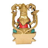 Brass Lakshmi statue side view with elephants, red waist belt and teal accents