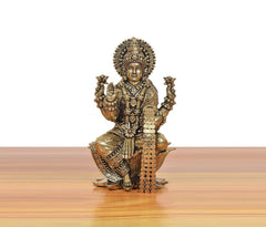 Bronze Lakshmi idol on lotus, front view with ornate crown and four handholds