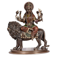 Bonded bronze Durga seated on lion, side view; detailed face, hands, and mane