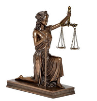 Resin Lady Justice kneeling figurine, scales hanging from raised arm, bronze-toned finish