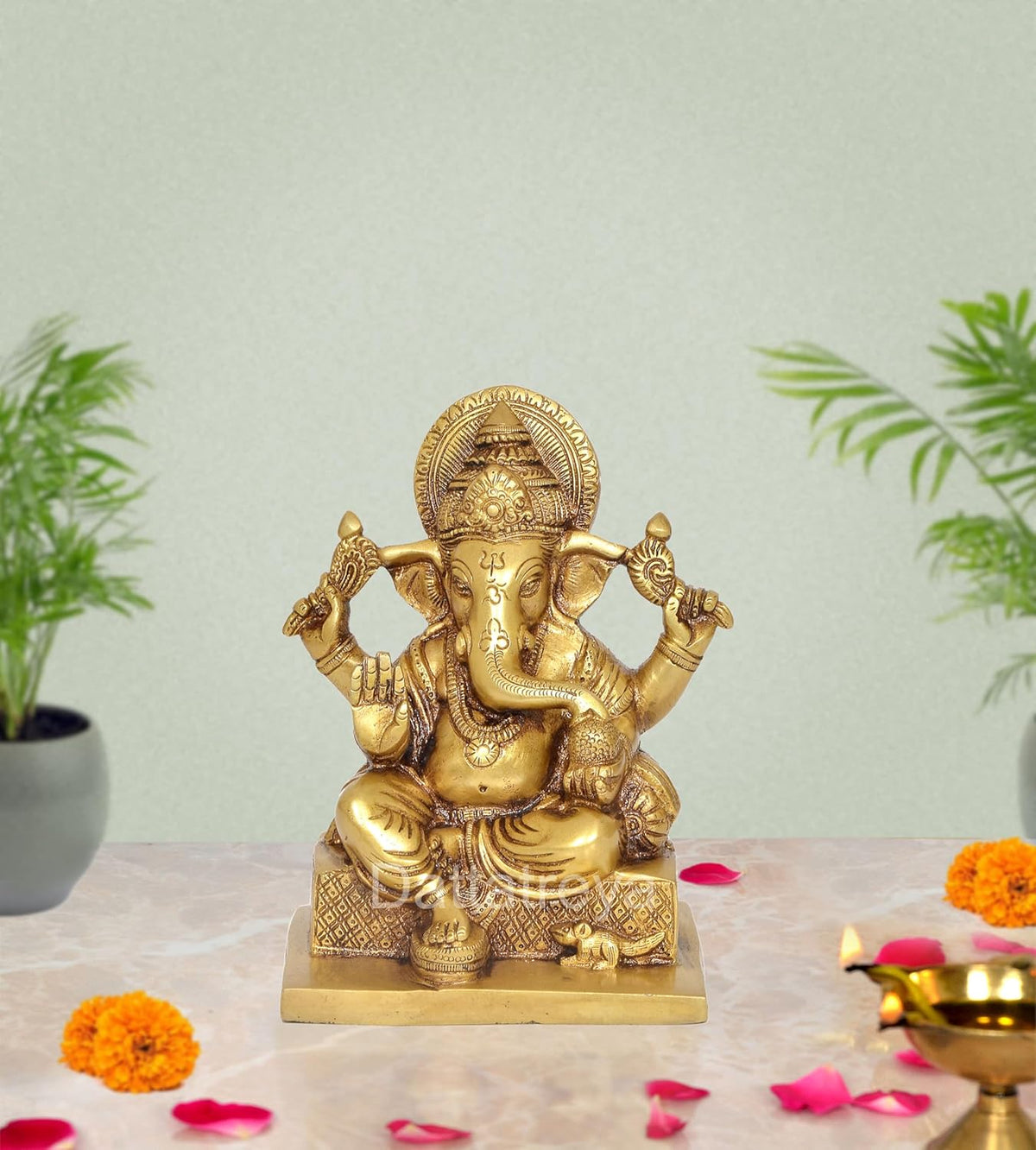 Brass Ganesha sculpture, seated with four arms and ornate crown, 7 inch height