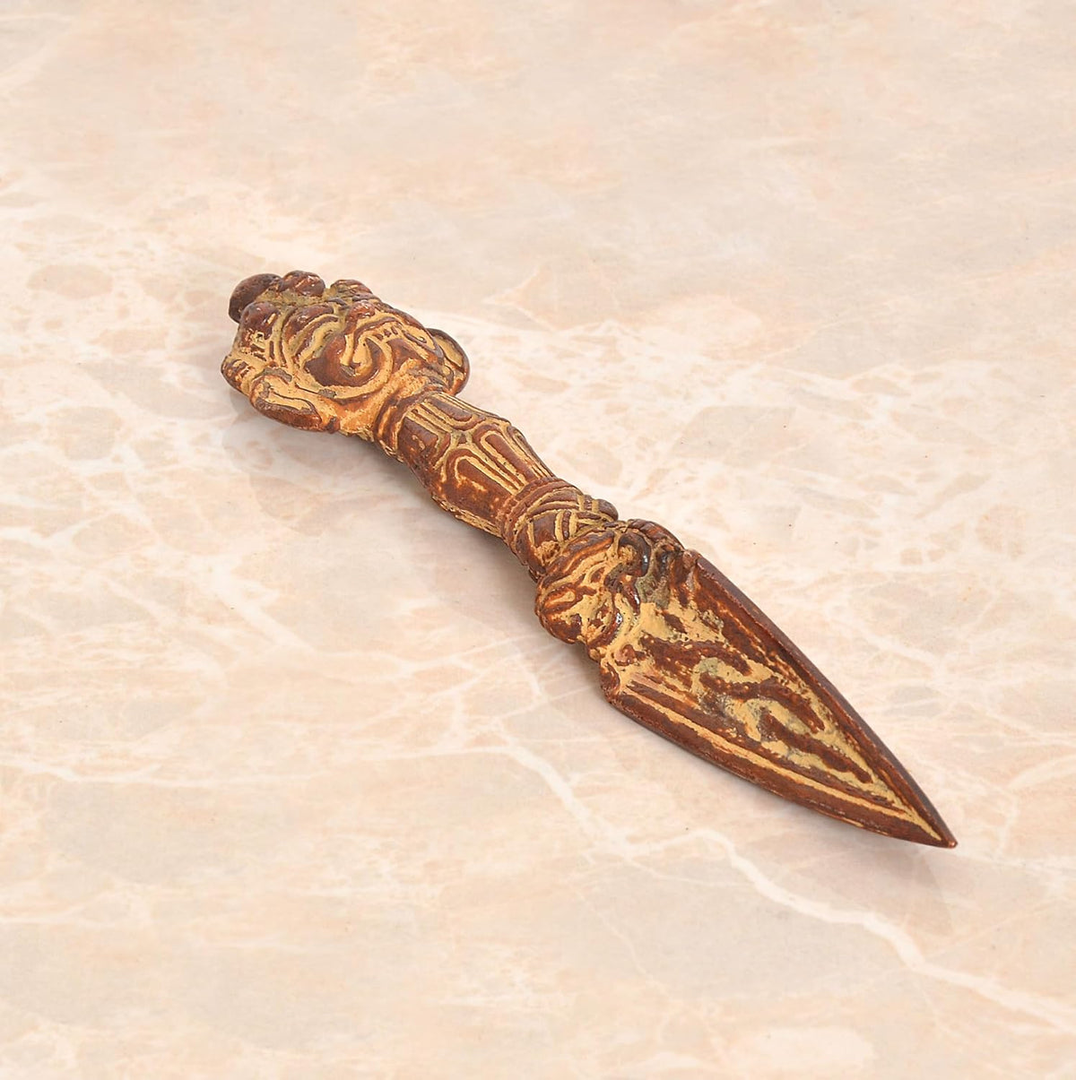 Brass Tibetan phurba dagger pendant with engraved vajra-style hilt and pointed blade tip