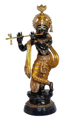 Krishna brass statue holding flute-like rod, black face and gold attire