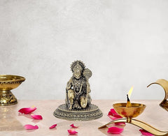 Brass Hanuman sitting idol statue with ornate crown and jewelry on round base