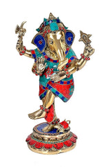 Dancing Ganesha brass statue, teal and red patterned outfit, blue ear ornaments, full view