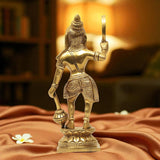 Brass Karuppaswamy sculpture, back view with raised weapon and embossed outfit, base