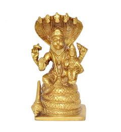 Gold brass Lakshmi Narasimha statue with ornate crown and seated Lakshmi figures