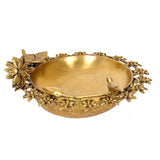Brass urli with peacock motifs and raised flower rim, ornate oval bowl, 12-inch