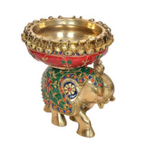 Brass elephant urli with red bowl and green base, blue and gold floral detailing