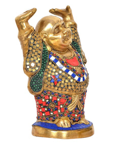 Brass laughing Buddha statue close-up view, raised arms, ornate jeweled robe and base