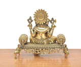 Brass Ganesha idol back view with sun-like crown disc and singhasan base