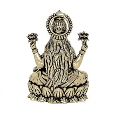 Lakshmi brass idol, back view, crown and long hair detail, four raised hands, seated