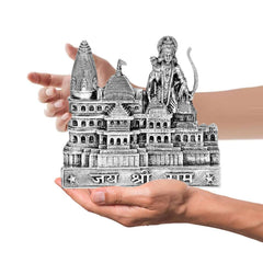 Silver Ram Mandir model held in hands, showing standing deity and intricate temple façade