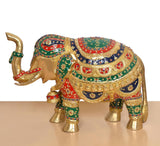 Brass elephant figurine front-left view, detailed painted borders and gold-tone textured sections